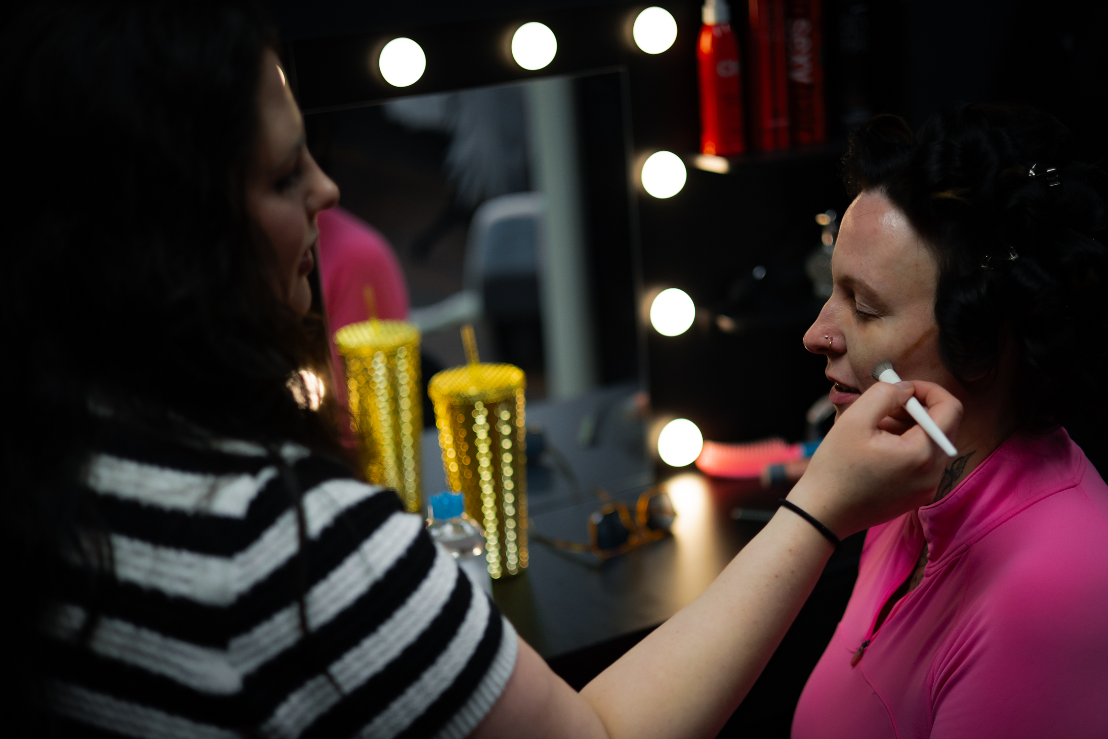 Lavish Luxe Boudoir hair and makeup artist working behind the scenes